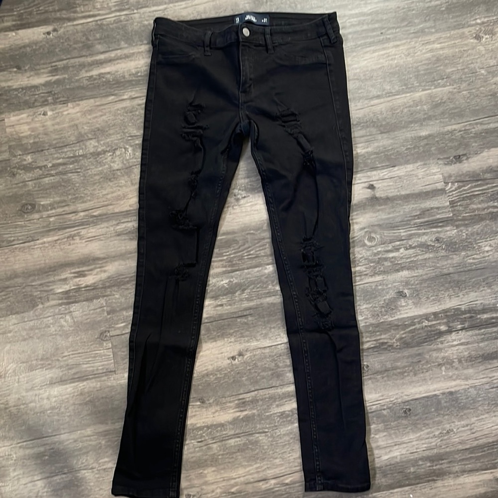 Black distressed super skinny jeans